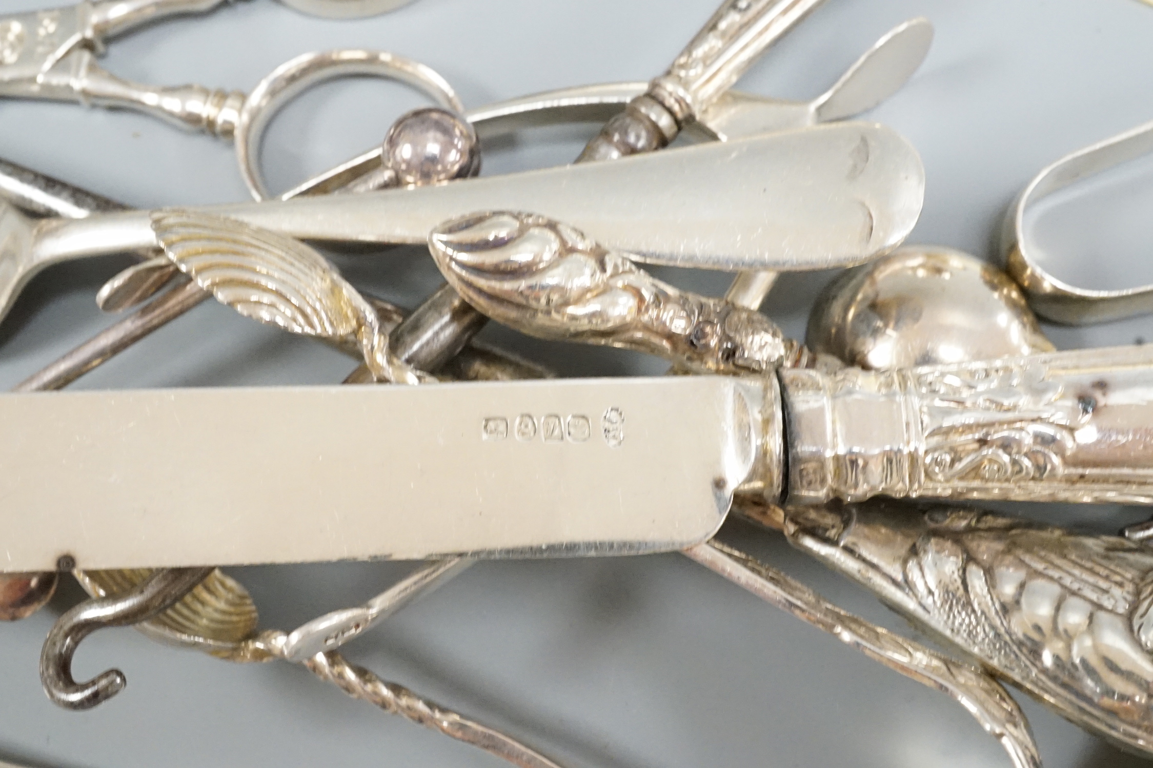 Sundry small silver including flatware, mounted calendar frame(a.f.), matchbox sleeves etc.